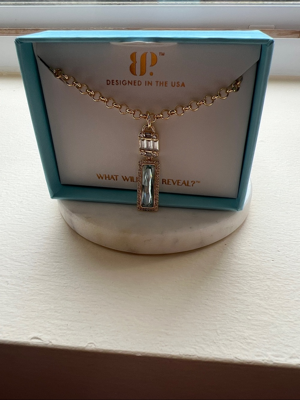 Gold-Tone Pendant Necklace with Pale Blue Crystal Accent